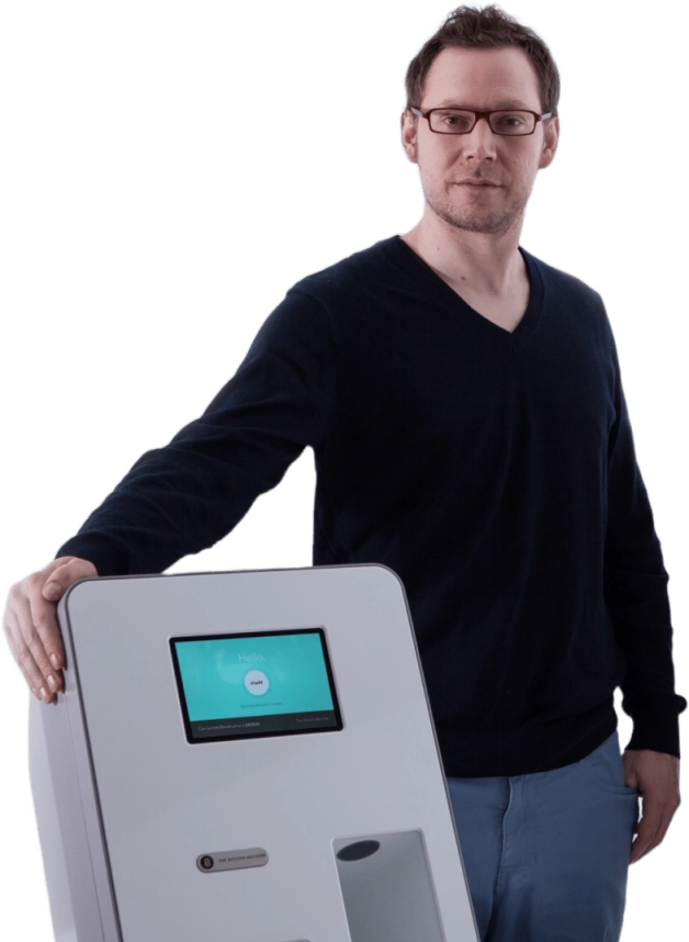 Portrait of Zach Harvey with a Lamassu ATM